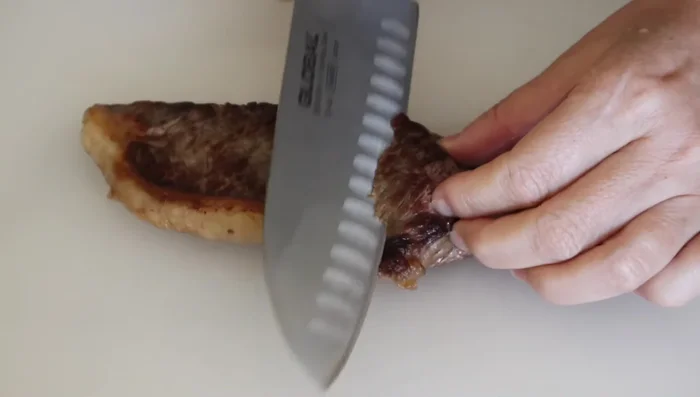 Cut steak into bite-sized pieces. Put steamed rice in a bowl, layer lettuce, then add the steak.