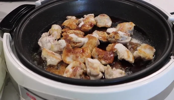 Add sugar, soy sauce, and sake. Immediately add the rest of the ingredients (napa cabbage, onions, tofu, mushrooms, and mizuna).