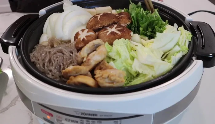 Add coac noodles and cook for about 10-15 minutes. Add more vegetables as you eat.