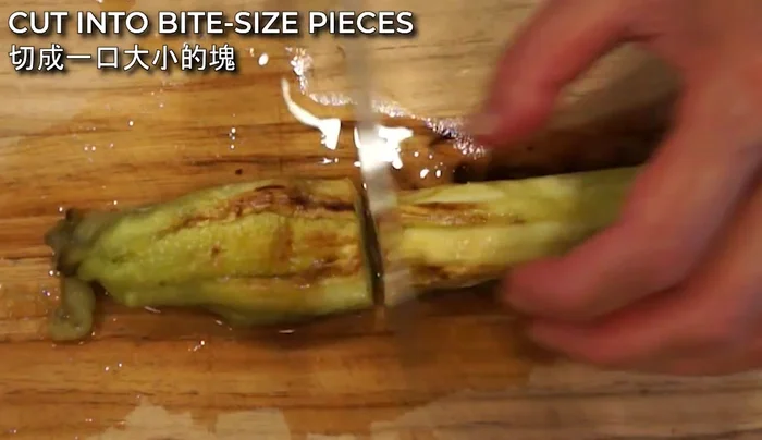 Cut the peeled eggplants into small, bite-sized pieces and place them on a serving plate.