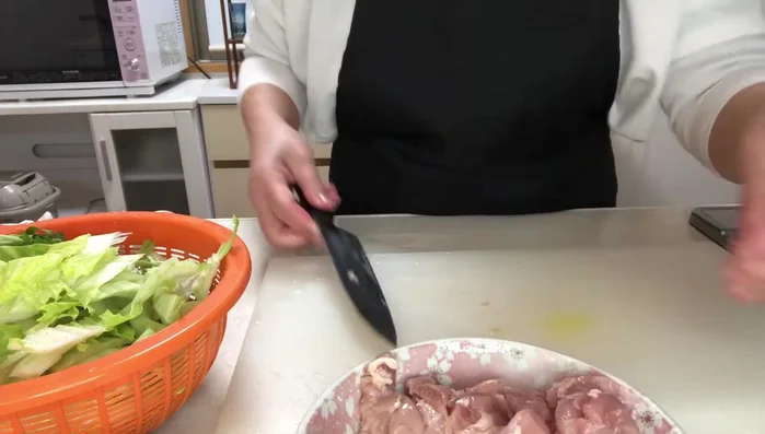 Cut chicken thighs into bite-sized pieces.
