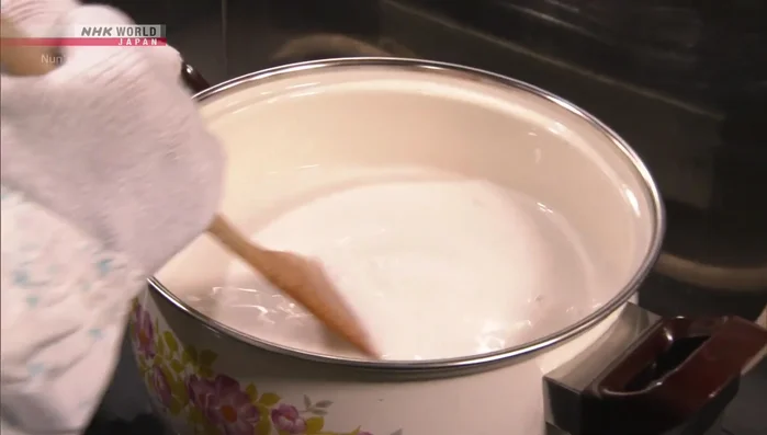 Continue to cook the mixture until it hardens, adding water as needed to maintain consistency. Be mindful of potential strain on your shoulders if it becomes too hard.