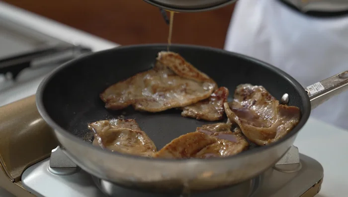 Add the remaining seasoning mixture to the pan and stir for a few seconds.