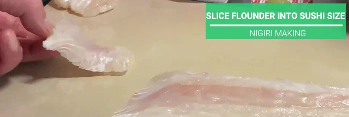 Slice the kombu-cured flounder into thicker (1.5cm) sushi neta (topping) slices using the kobagashi technique (tilting the knife perpendicularly before it touches the board).