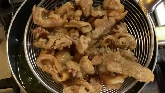 Serve immediately and enjoy your crispy chicken skin chicharon!