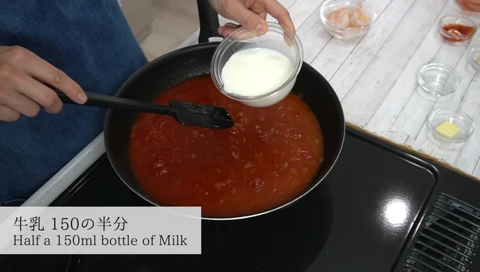 Add half of the milk and water; mix well. Add thawed shrimp and bring to a boil.