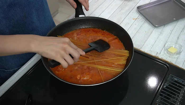Add pasta, ensuring it's fully submerged. Cook for 1 minute longer than package instructions, adding a little water if necessary.