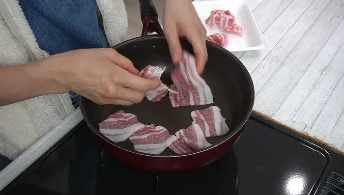 In the same pan (no need to add more oil), cook the pork belly until about half cooked.