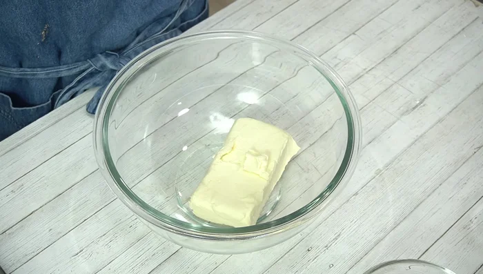 Make the cheesecake batter: Soften cream cheese in the microwave. Add sugar and mix until smooth. Add eggs one at a time, mixing well after each addition. Stir in lemon juice, then the drained yogurt, and finally, the fresh cream and flour.
