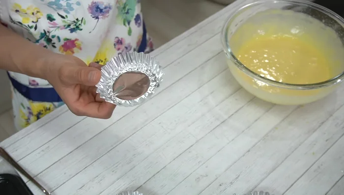 Fill the madeleine cups about ¾ full with batter. Sprinkle with diced almonds (optional).