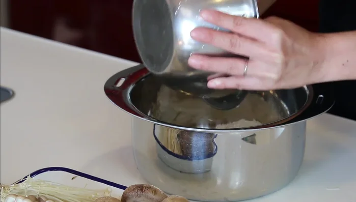 Place the rinsed rice in a rice cooker and add 2 cups of water (1:1 ratio of rice to water). Soak for at least 30 minutes.