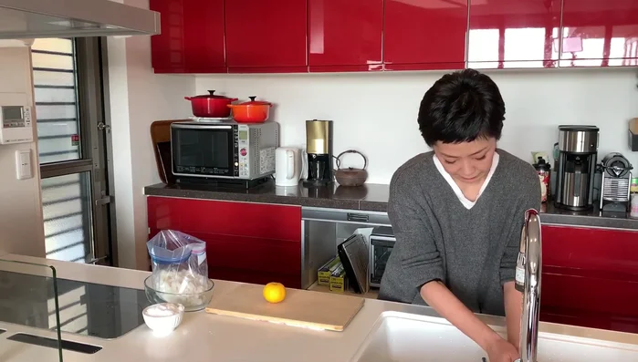 Wash and dry the yuzu citrus. Peel only the yellow part of the skin, avoiding the white pith, and slice it into thin strips.