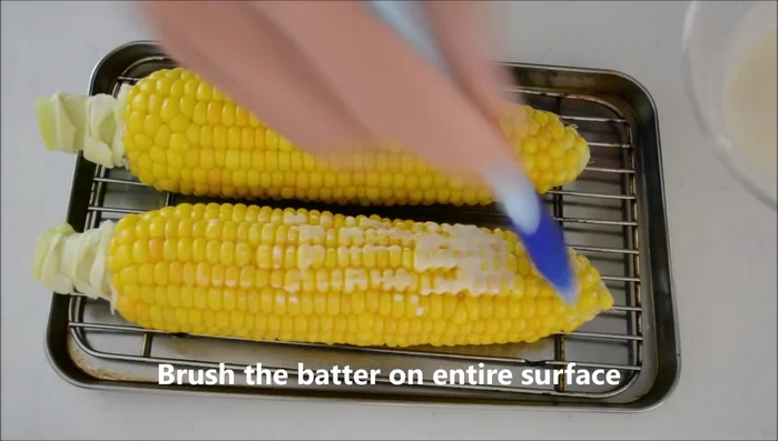 Brush the batter over the entire surface of the corn. [73.84]