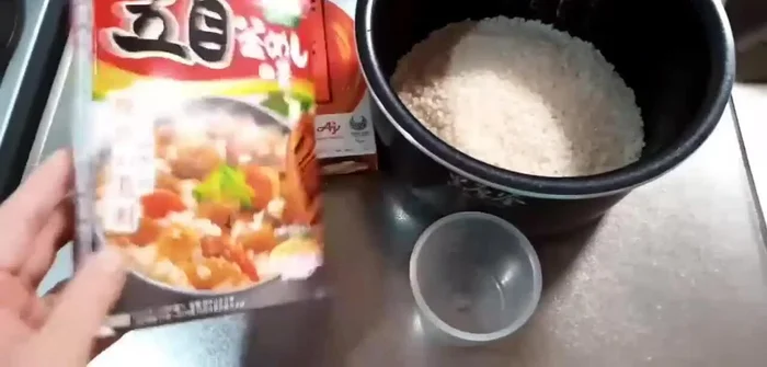 Cook the rice mixture in a rice cooker or pot following package directions (usually involves cooking until the water is absorbed).