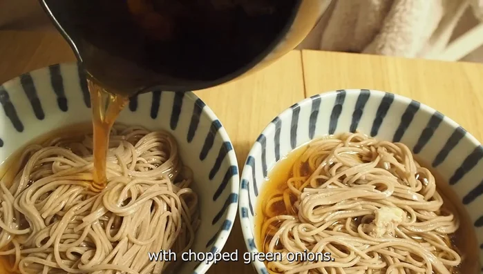 Place the noodles in bowls, pour the hot broth over them, and garnish with chopped green onions.