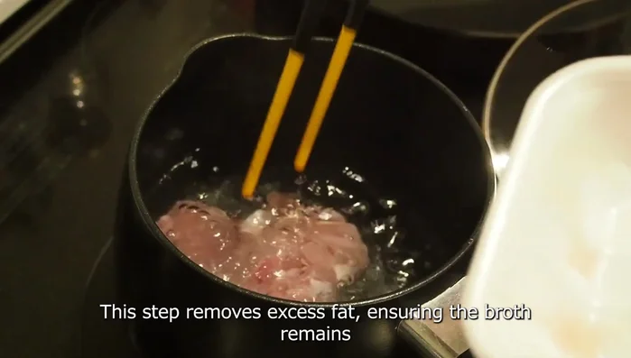Cut the chicken into bite-sized pieces and quickly blanch them in boiling water before draining. This step removes excess fat.