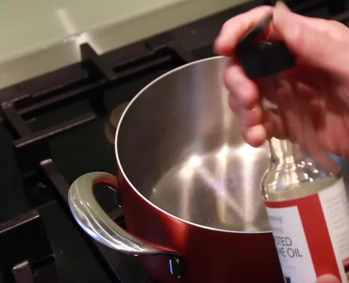 Heat a pan with a strong flame, add 2 tablespoons of Clear Spring Toasted Sesame Oil. Add ginger, then onion, stir well. Add carrots and leak, stir for 1 minute.
