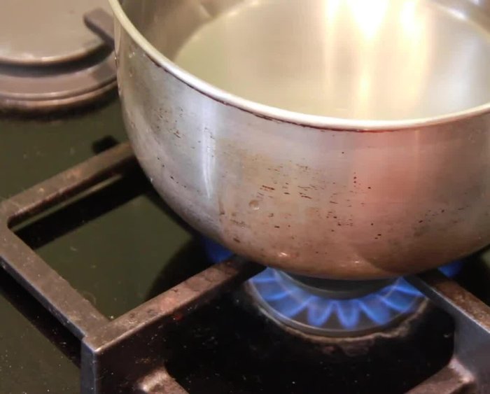 Heat 1.5L of water in a pan until boiling. Add 1 pack of Clear Spring Wide Udon noodles and cook according to package directions.