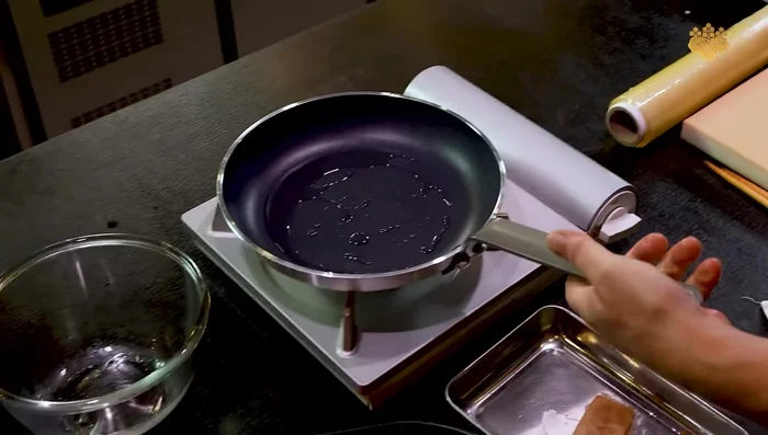 Fry the marinated beef until cooked.