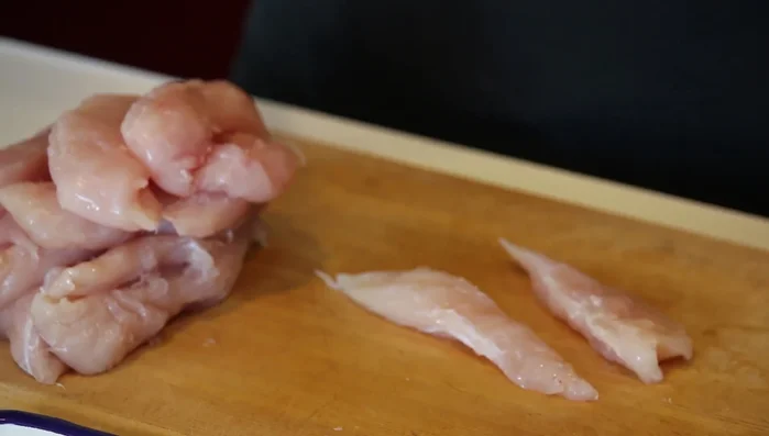 Cut the chicken into halves, ensuring even sizes. (120.36)