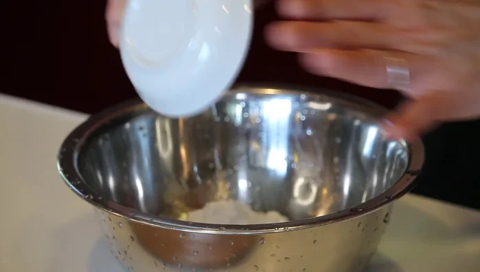 Prepare the tempura batter by mixing flour, potato starch, and cold water. Avoid overmixing. (203.04)