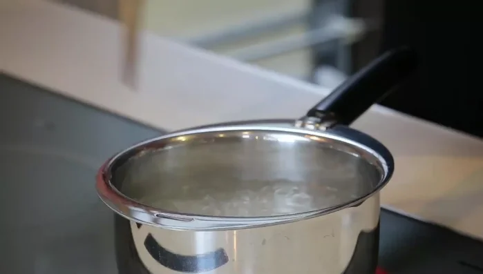 Blanch the carrot strips in boiling water for 1 minute.