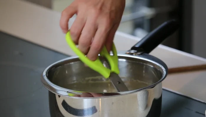 Cut the cooked glass noodles using kitchen scissors while they are still in the pot.