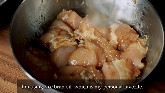Fry the chicken: Preheat oil to 170°C (340°F). Gently drop chicken pieces into the batter, ensuring they're fully coated. Fry for about 4 minutes, turning halfway, until golden brown and the bubbling sound changes to a quieter crackling.