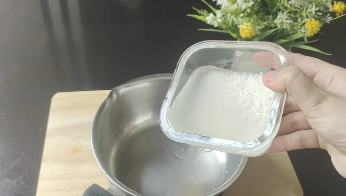 Next morning, cook the soaked rice until it's about 50% cooked. The rice should be soft but not mushy.
