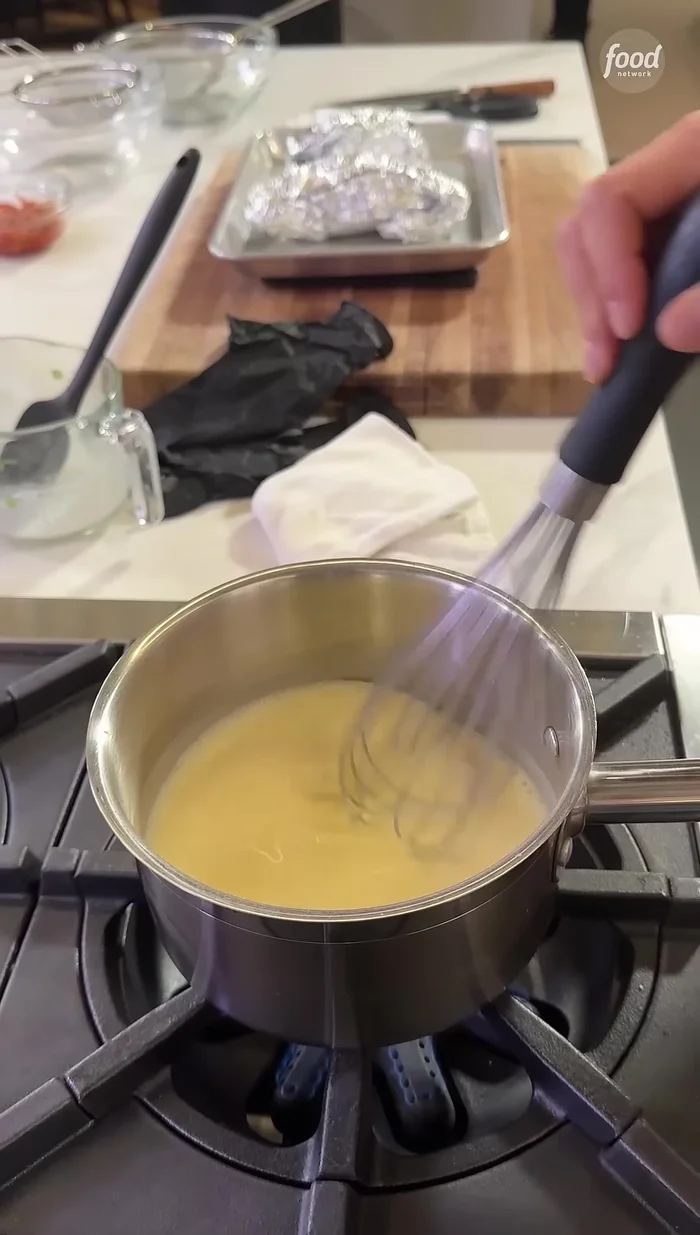 Slowly whisk in the heavy cream, ensuring no lumps form. This may take 5-7 minutes.