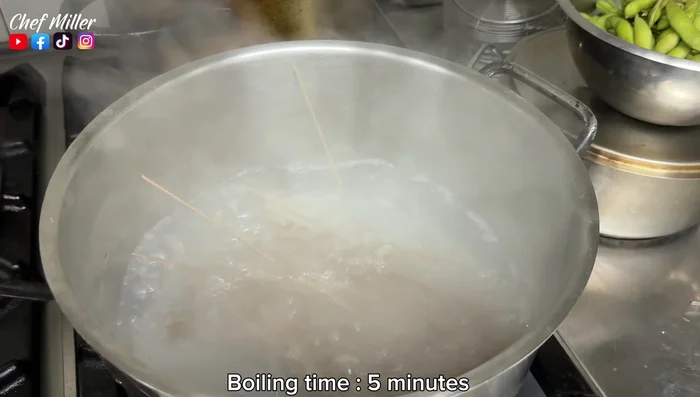 Boil the soba noodles for 5 minutes, gently stirring before draining and rinsing under cold water.