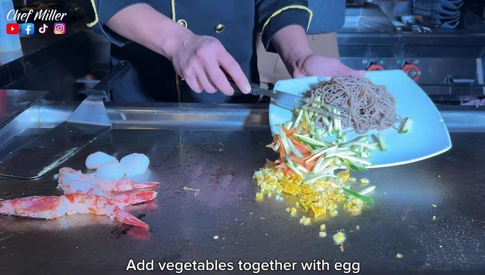 Add seafood and vegetables to the grill, along with salt and butter.