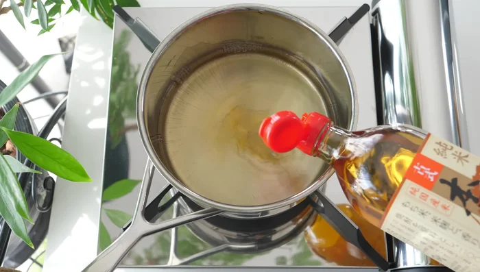 Prepare the sukiyaki sauce: Mix mirin, sugar, and soy sauce, allowing the sugar to melt.