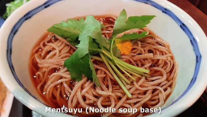 Make the Mentsuyu (soup base): Combine water, dashi packet, soy sauce, mirin, and sugar. Boil on low heat for 5 minutes, remove the packet, and then turn off the heat. Add a little water when using for soba.