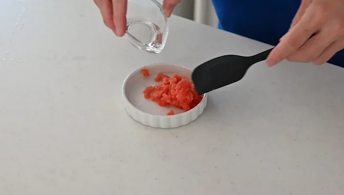 Put the roe in a small dish and pour in one tablespoon of sake (or white wine) to remove any fishy smell.