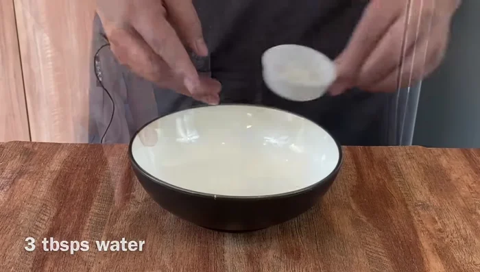 Prepare marinade: Mix water, salt, white parts of spring onions, and ginger. Squeeze to extract juices.