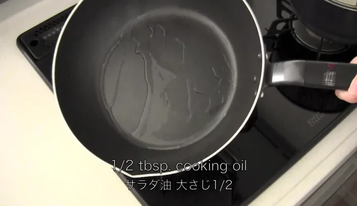 Heat cooking oil in a frying pan and cook tofu until golden brown. Set aside.