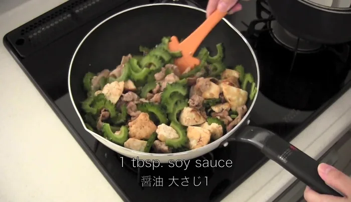 Season with soy sauce (reduce amount if using ham, bacon, or spam), salt, and pepper.