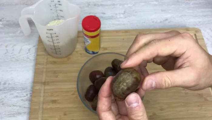 Choose chestnuts that are firm, round, and possibly have cracks indicating fullness. Avoid those that are soft or dented.