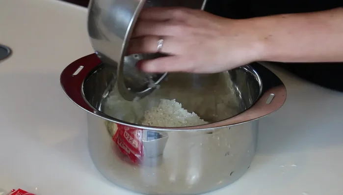 Add rice and water (2 cups each) to a pot. Let it soak for at least 30 minutes.