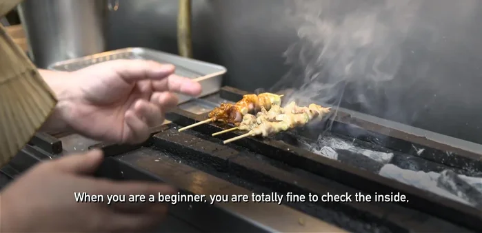 Grill the tsukune skewers over charcoal for 5-8 minutes per stick, turning occasionally to ensure even cooking. The key is to achieve a balance between cooking the meat through and maintaining its juicy texture.