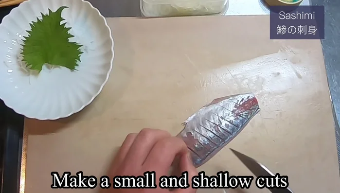 For Sashimi Aji: Trim both ends of the fillet and make shallow diagonal cuts on both sides for easier chewing and better aesthetics.