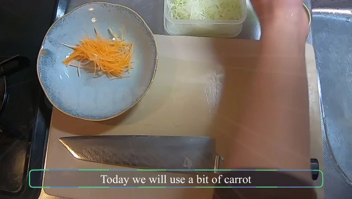 Prepare the tsukemono (pickled vegetables). Use shredded carrot and shiso for color.