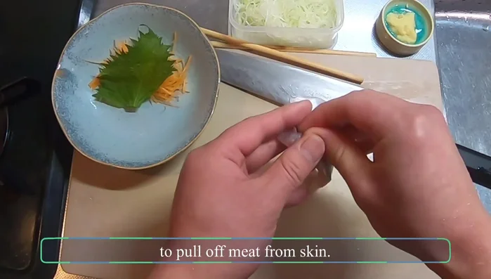Peel the skin from the aji fillet. Pinch the thickest part of the skin and use your thumb to pull off the meat.