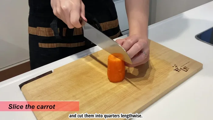 Prepare the carrots by cutting them into quarters lengthwise and then slicing into 5mm width pieces.