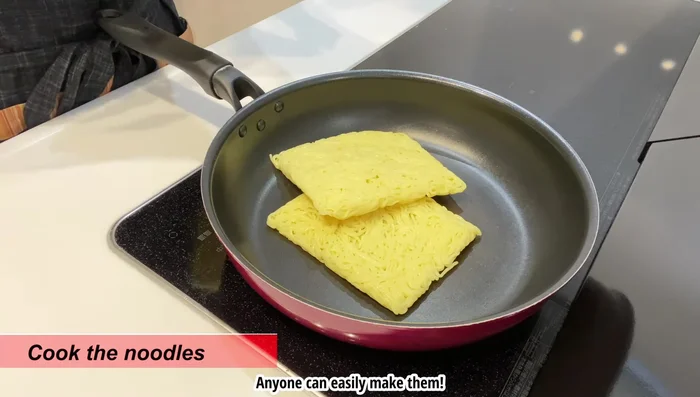 Cook the noodles: Add noodles to a frying pan with 1 tbsp sesame oil. Add a little water to loosen if needed. Fry over medium heat, adding another tbsp of sesame oil later for crispiness. Fry slowly and patiently to avoid burning.