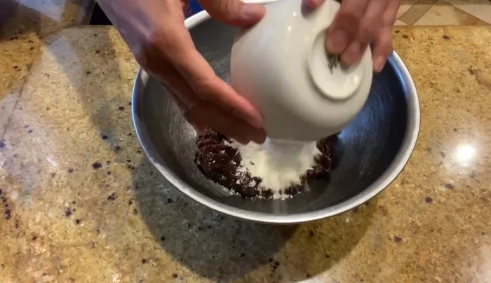 In a bowl, combine the anko, flour, cornstarch, sugar, water, and salt. Mix well until sticky. (You can use your hands or a spatula).