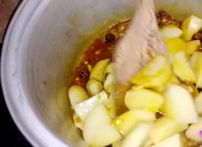 Add fried potatoes and mix well with spices.