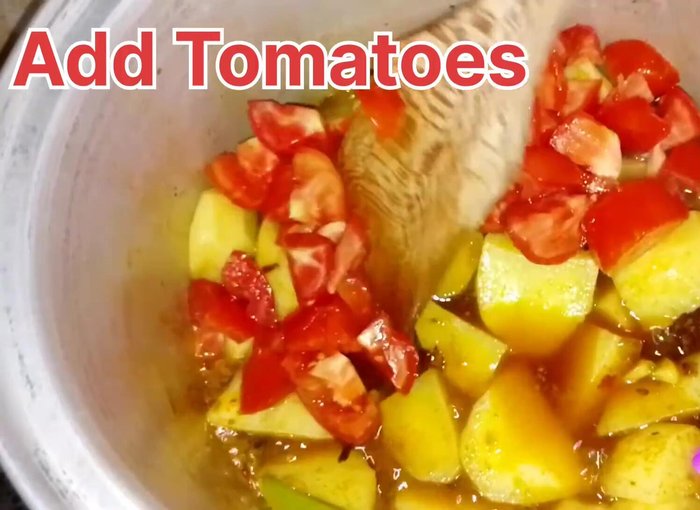 Add tomatoes and fry until slightly burnt.