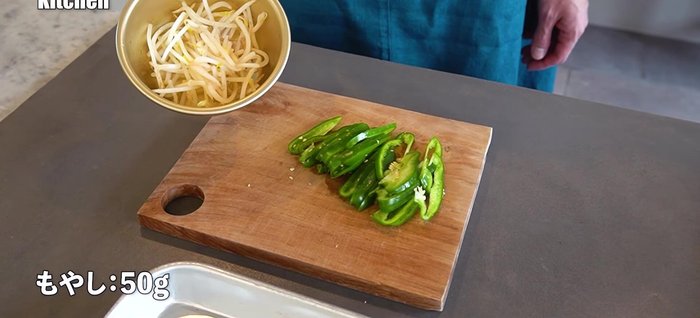 Prepare bean sprouts: Wash and drain.